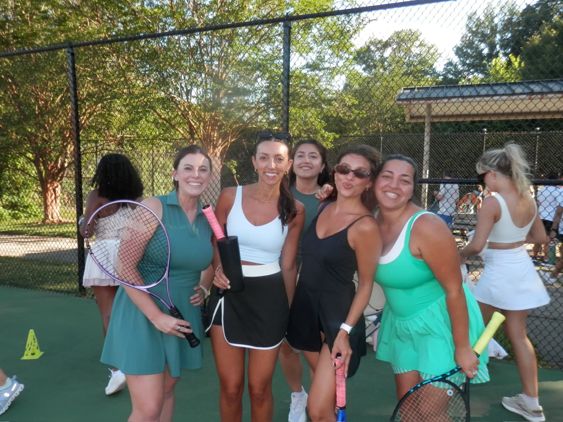 Five Tardeo players together with rackets on court in Charlotte